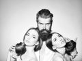 Man with serious emotion. Bearded man and two women Royalty Free Stock Photo