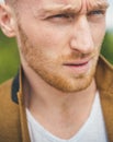 Man with serious face and brutal style. Close up portrait of severe hot guy. Barbershop advertising. Short beard Royalty Free Stock Photo