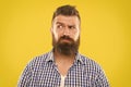 Man serious face raising eyebrow not confident. Have some doubts. Hipster bearded face not sure in something. Doubtful Royalty Free Stock Photo