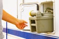 Man serving caravan, tank toilet cassette in dump station Royalty Free Stock Photo