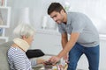 Man serving meal to injured woman Royalty Free Stock Photo