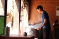 A man serving Momo at one shop, the South Asian or Tibetan dumpling