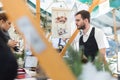 Man serving street food on international cuisine event in Ljubljana, Slovenia.