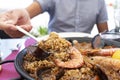 Man serving a typical spanish seafood paella Royalty Free Stock Photo