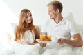 Man serving woman a breakfast Royalty Free Stock Photo