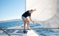 Man setting sail on his boat Royalty Free Stock Photo