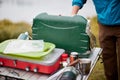 Man setting up a camping gas stove outdoors Royalty Free Stock Photo