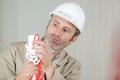 Man setting up exclusion zone around work site Royalty Free Stock Photo