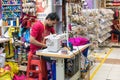 Man sewing in Tekka Center, Little India, Singapore