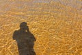 Man shadow, sea Water and Sand Structure Golden fine sand