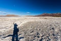 Man shadow selfie pink flamingo birds flock lake, Bolivia. Royalty Free Stock Photo