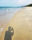 Man shadow taking photo at beach Royalty Free Stock Photo