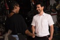 Man shakes hand with woman. Diversity of two people, caucasian business manager smile and shake hand with black African worker Royalty Free Stock Photo