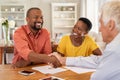 Man shaking hands with insurance agent