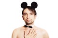 Man with a sham mouse ears on white background