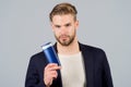 Man with shampoo or conditioner bottle