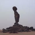 Man shaped rock in sahara desert