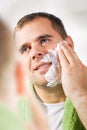 Man shaves his face Royalty Free Stock Photo