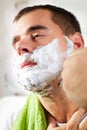 Man shaves his face Royalty Free Stock Photo