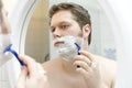 Man shaving. Royalty Free Stock Photo
