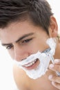 Man shaving with razor Royalty Free Stock Photo