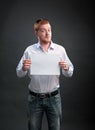 Man with a sheet of paper in his hands Royalty Free Stock Photo