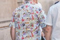 Man with shirt with comics design before Prada fashion show, Milan Fashion Week street style on June 17, 2018 in
