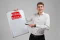 Young man holding final notice isolated on light background Royalty Free Stock Photo