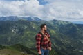A man in a shirt is a traveler on the top of the Polish Tatra Mountains Royalty Free Stock Photo