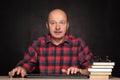 Man in shirt works at the computer, typing text on keybo Royalty Free Stock Photo