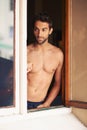 Man, shirtless or window as thinking, body or idea of summer to relax, planning or vision of vacation. Guy, tourist or Royalty Free Stock Photo