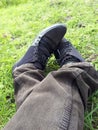 Man shoes in the Park,Canvas Shoes,Man Siting in the park Royalty Free Stock Photo