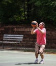 Man shooting basketball 3