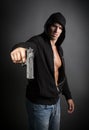 Man shooting gun isolated on gray background Royalty Free Stock Photo