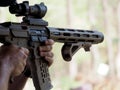 Man shooting on an outdoor shooting range