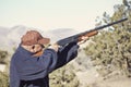 Man Shooting a Shotgun Hunting