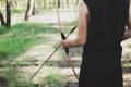 A man shoots a bow in the open air. Royalty Free Stock Photo