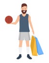 Man with shopping bags and a ball in his hands. Young fashion shopper guy going to play basketball