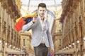 Man with shopping bags in Vittorio Emanuele Gallery, in Milan