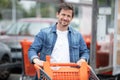 man with shopping cart at supermarket Royalty Free Stock Photo