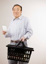 Man shopping for groceries with shopping list Royalty Free Stock Photo