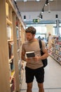 Man shopping in light bookstore