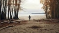 A man on the shore of a lake or the sea looks longingly into the distance