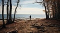 A man on the shore of a lake or the sea looks longingly into the distance