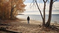 A man on the shore of a lake or the sea looks longingly into the distance