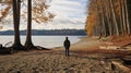 A man on the shore of a lake or the sea looks longingly into the distance