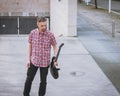 Man in short sleeve shirt holding electric guitar Royalty Free Stock Photo