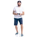 Man in shorts and cap with gamepad in hand