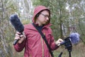 The man with Shotgun Condenser Microphone and headphones is recording the sounds of nature. Royalty Free Stock Photo