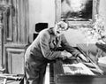 Man shouting with his hand caught in a piano